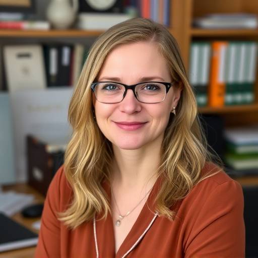 Portrait of Elara Vance, the Head of Editorial, a composed woman with an organized desk in the background.